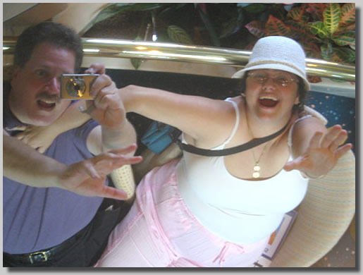 Ruthie and Dennis being silly with a mirrored ceiling