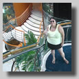 Rooty Jr. posing on the formal stairway to deck 6
