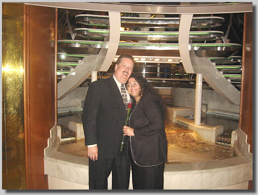 Dennis and Ruthie in front of the great little fountain on deck 4 in the Centrum.