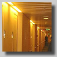 Dennis posing in front of the long hallway that led to the cabins on deck 4 where our cabin was. This was on the way up to the formal dinner where I proposed to her. I was a pretty happy guy just then, a bit nervous, but very happy.