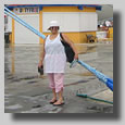 Ruthie on the dock at Cozumel, Mexico standing between our ship, Rhapsody of the Seas and Mariner of the Seas, which was almost twice as large as our ship.
