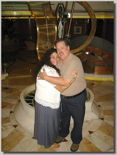 Ruthie and Dennis in front of a bizarre sculpture on deck 4