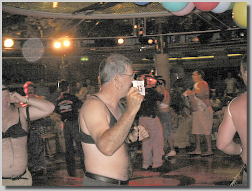 This was from a very fast paced game show held in the Shall We Dance Lounge on Deck 6. It was called Quiz Show and people had to do all sorts of silly and humiliating things really quick. A surprising number of people had no problem running around with bras on (men) and slithering on the floor.