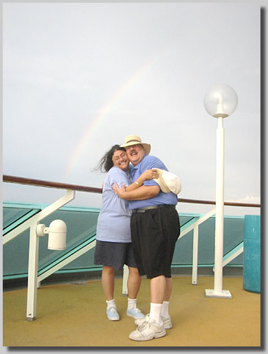 I liked the rainbow so much I could not resist putting the camera on a mini-tripod and getting in a shot with my cutie.