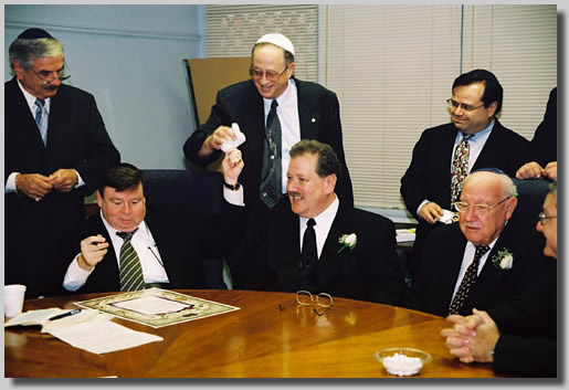 The men around the round table doin' bizness. Some bizarre ritual with a piece of cloth.