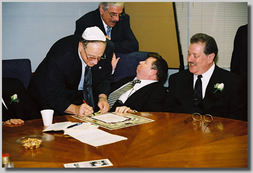 The men around the round table doin' bizness. The witnesses signing away.