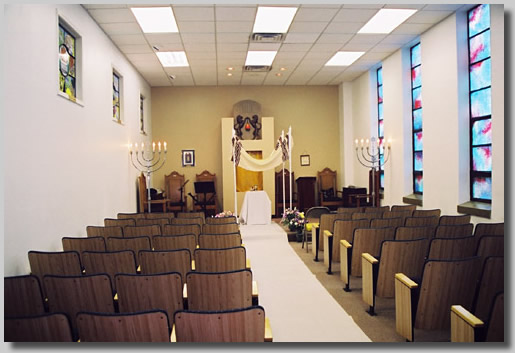 The chapel all empty and quiet before the crowd entered. This was right after Joyce had sprayed it with a harmony potion that Rooty Jr. had given her so good thoughts would be in the chapel.