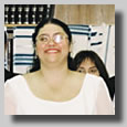 This is the wedding Processional with Rooty Jr. beaming as she is escorted in by Fortuna and Isaac, her parents.